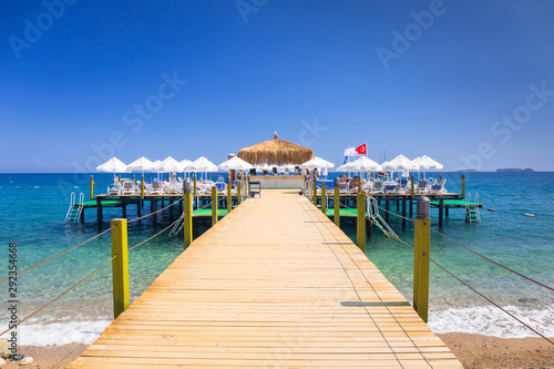 Fototapeta Naklejka Na Ścianę i Meble -  Wooden pier on the beach of Turkish Riviera, Tekirova