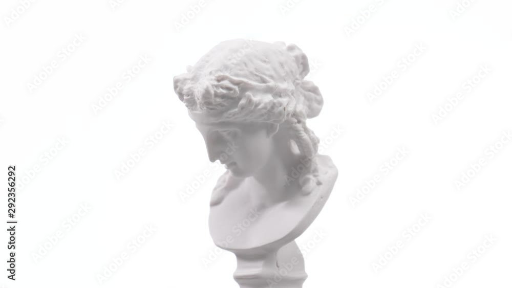 Old roman white marble statue rotating against a white background. Closeup shot Old roman white marble statue rotating against a white background. Closeup shot