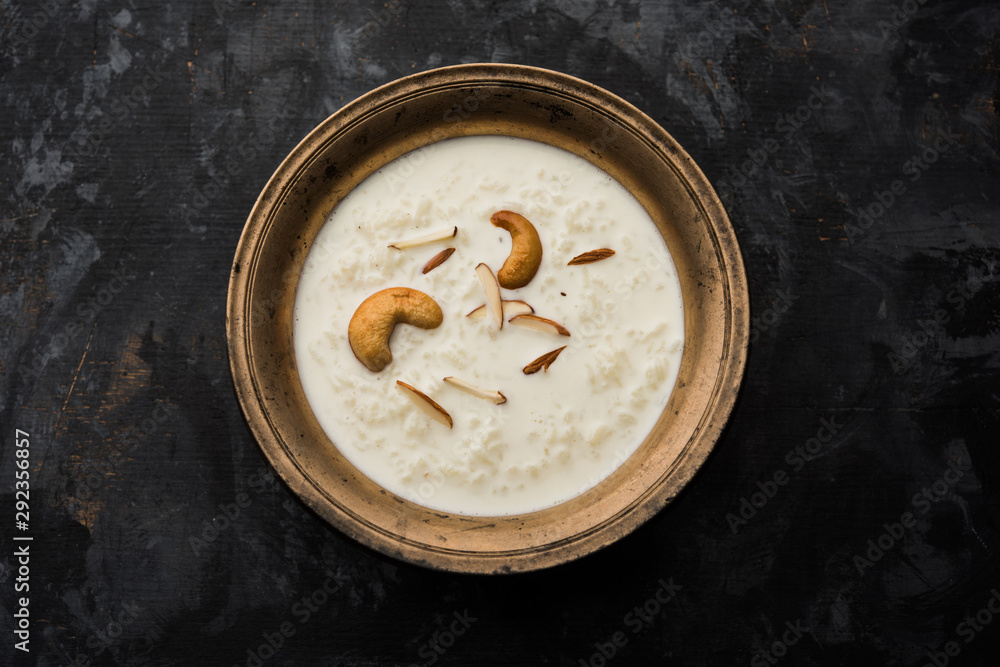 Rice Kheer or Firni or Khir is a pudding from Indian subcontinent, made by boiling milk ,sugar and Rice. Served in a bowl Rice Kheer or Firni or Khir is a pudding from Indian subcontinent, made by boiling milk ,sugar and Rice. Served in a bowl