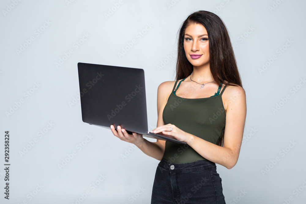 Young woman with laptop, isolated on white background Young woman with laptop, isolated on white background