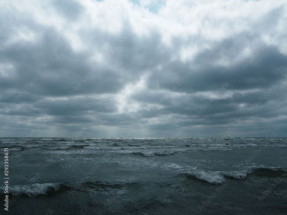 Gray sky over stormy sea