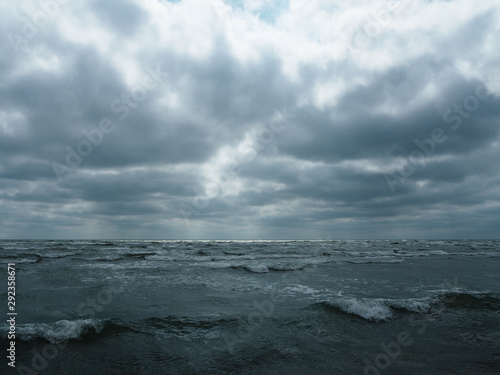 Gray sky over stormy sea