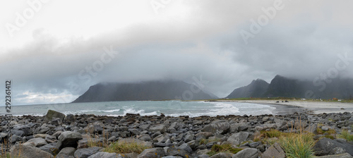 Lofoten mountain landscape with clouds and ocean Norway 