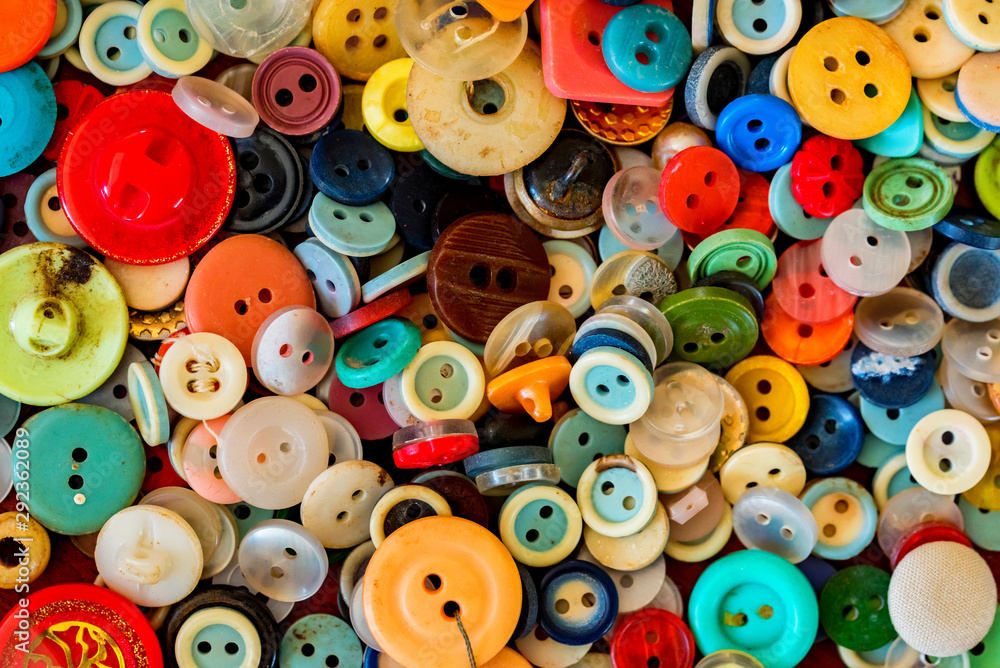 Close up of sewing colorful buttons background Close up of sewing colorful buttons background