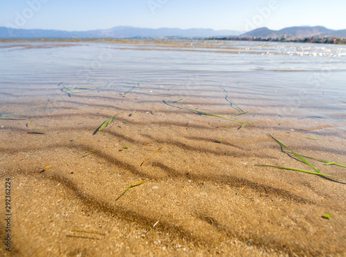 Panoramic views of the sandy beach,  mountains  the island of Evia on Liani Ammos beach in Halkida, Greece on a Sunny summer day photo