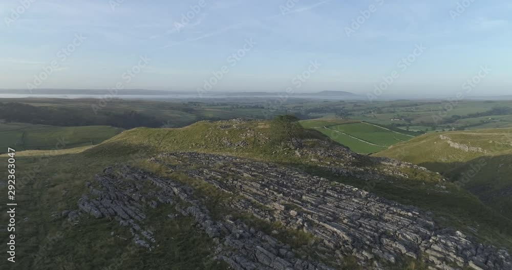 Aerial shot of flying above the countryside in the morning. Aerial shot of flying above the countryside in the morning.