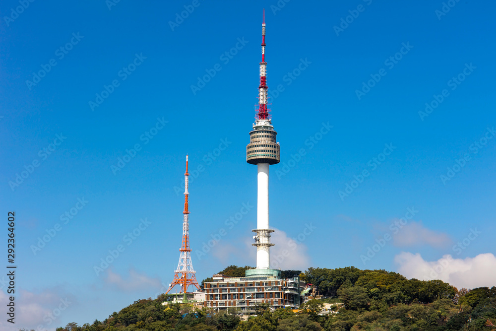 Seoul tower Located on Namsan Mountain with blue sky white clouds  in Seoul, South Korea.