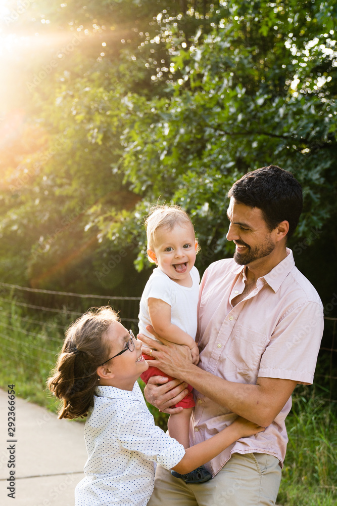 Portrait of father with a beard holding happy toddler son Portrait of father with a beard holding happy toddler son