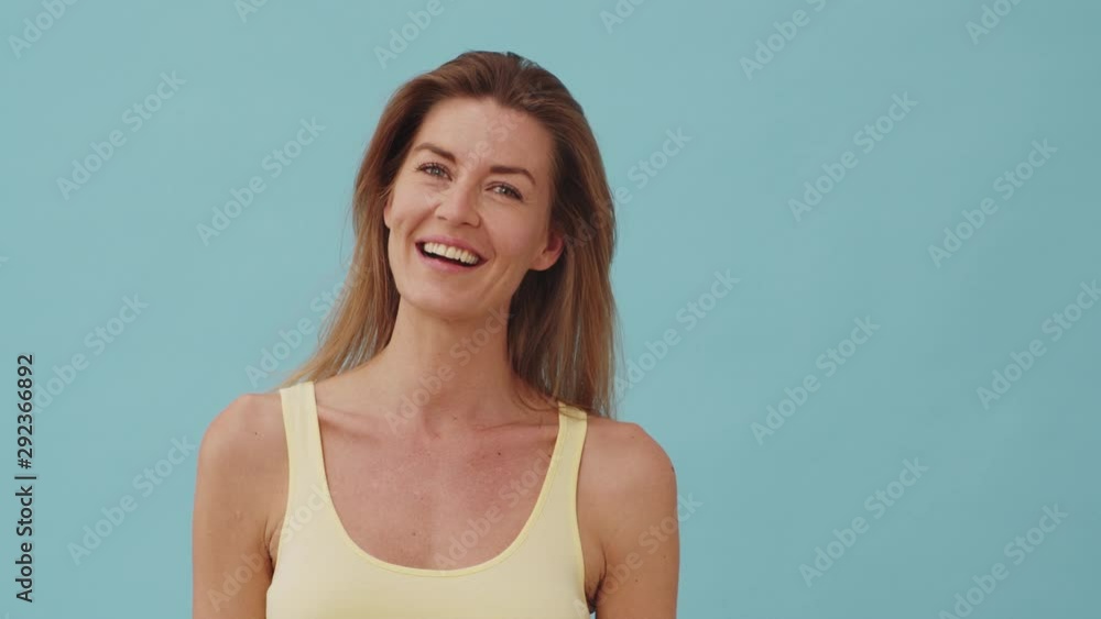 Steady Shot of a Woman with Dimpled Cheeks Laughing and Waving her Head Steady Shot of a Woman with Dimpled Cheeks Laughing and Waving her Head