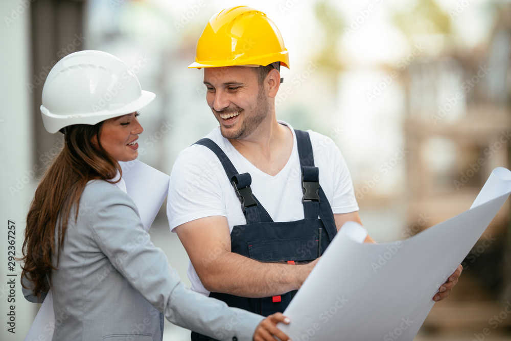 Architect and worker discussing project Architect and worker discussing project