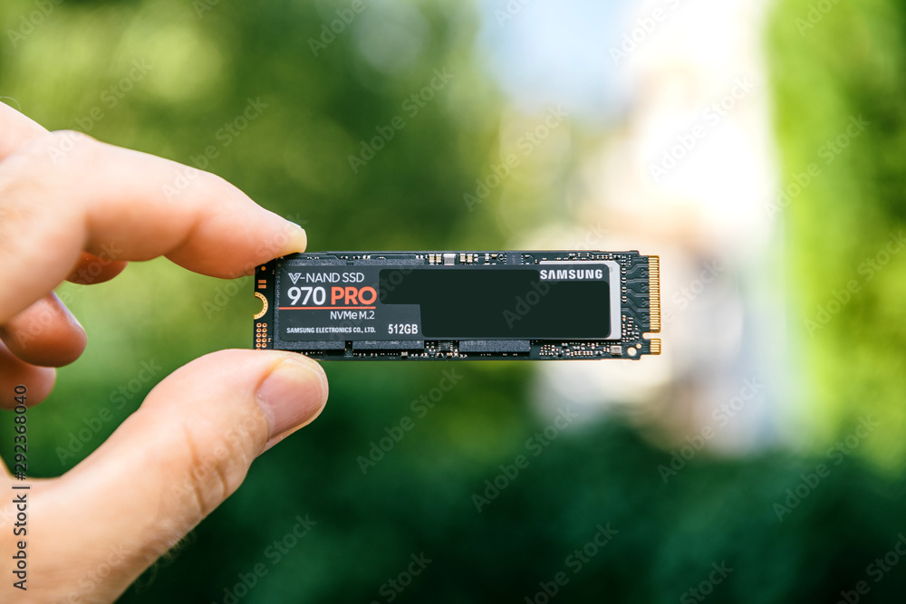 PARIS, FRANCE - JUL 27, 2018: Man hand holding new Samsung 870 Pro NVME  PCIE SSD hard drive disk front face with high read and write speed Samsung  870 Pro Stock Photo | Adobe Stock
