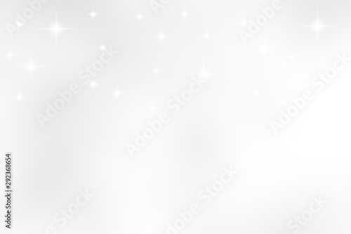 abstract blur soft focus white color background with star glittering light for show,promote and advertisee product and content in merry christmas and happy new year season collection concept