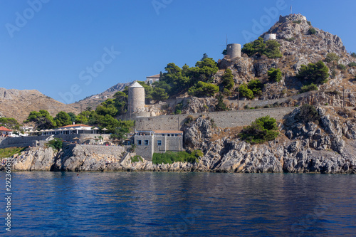 Quadro su tela Hydra Island port view in Greece - Wind mills and towers
