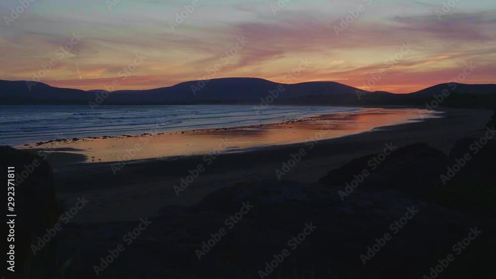 Slow motion shot of sea waves hitting the beach on a beautiful sunset Slow motion shot of sea waves hitting the beach on a beautiful sunset