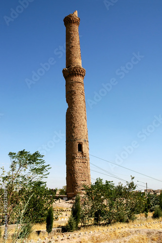 Herat in Afghanistan. One of the Musalla Minarets of Herat part of the Musalla Complex. This minaret is leaning at a precarious angle, held by cables. An important historical site in west Afghanistan.