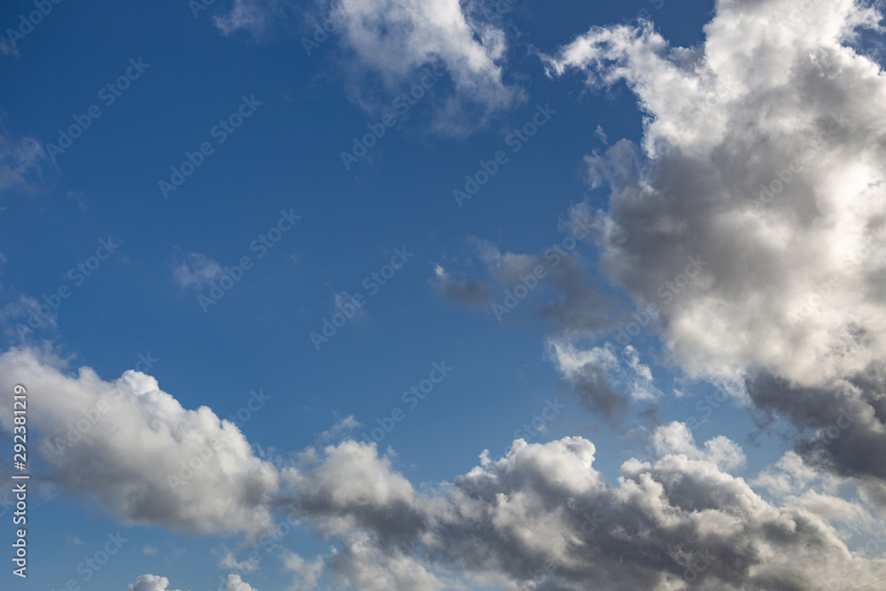 Blue sky with white and dark clouds background Blue sky with white and dark clouds background