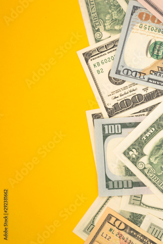 One hundred dollar banknotes on colored background top view, with empty place for your text business money concept.