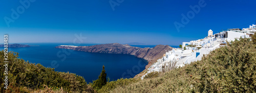 Panoramic view of Imerovigli village, the Aegean sea and Oia city from the walking trail number 9 between the cities of Fira and Oia at Santorini Island