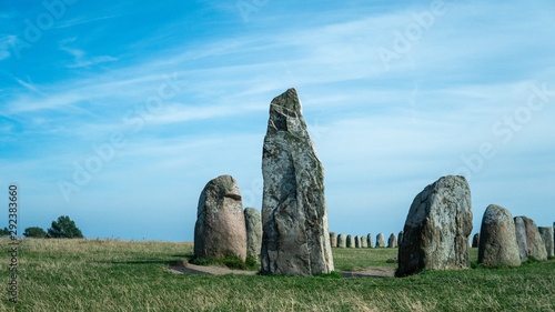 Landmark - Ale Stones (Ales stenar) old monument of stones. A sunny summer day in Kåseberga, Sweden.