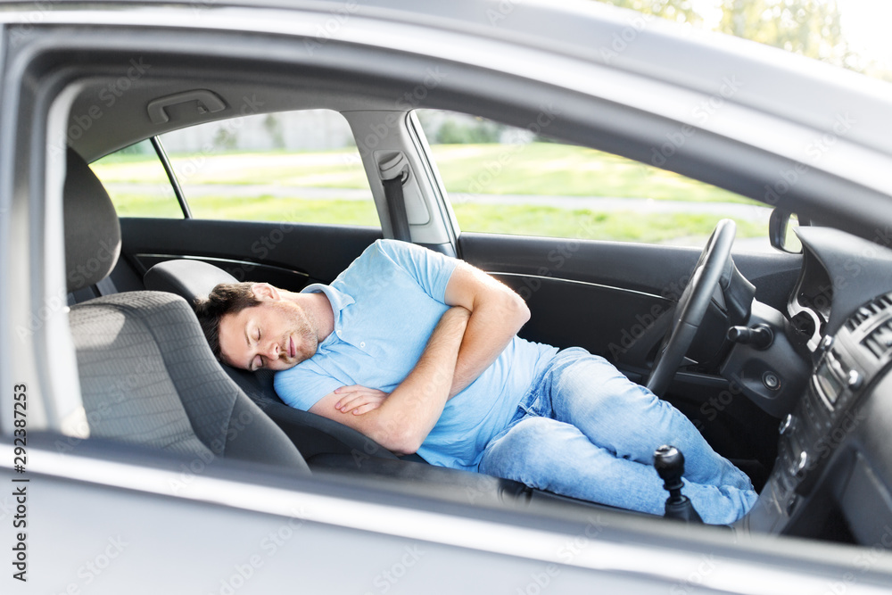 transport, rest and driving concept - tired man or driver sleeping in car transport, rest and driving concept - tired man or driver sleeping in car