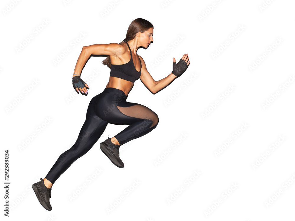 muscular woman in black sportswear running isolated on white background