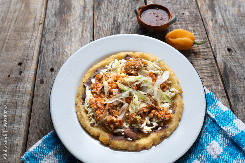 Mexican food: sopes of Picadillo beef with cheese and beans Mexican food: sopes of Picadillo beef with cheese and beans