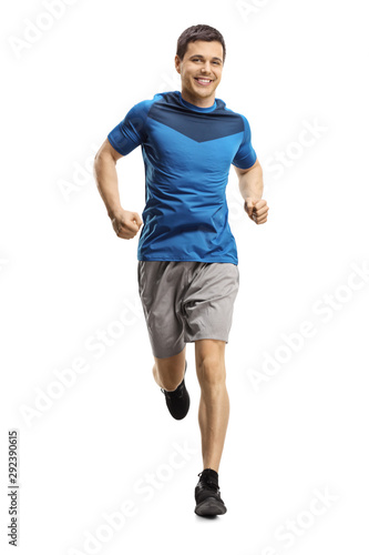 Young man jogging towards the camera