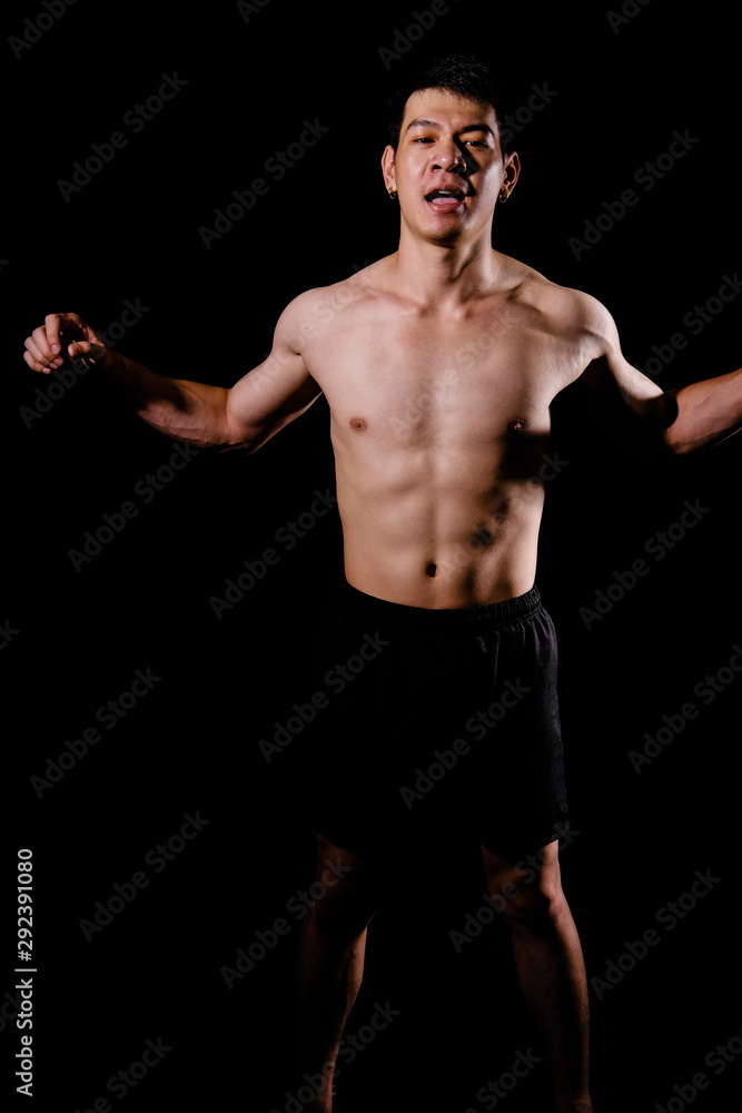 Fototapeta premium athletic muscular bodybuilder man with naked torso six pack abs. fitness workout concept