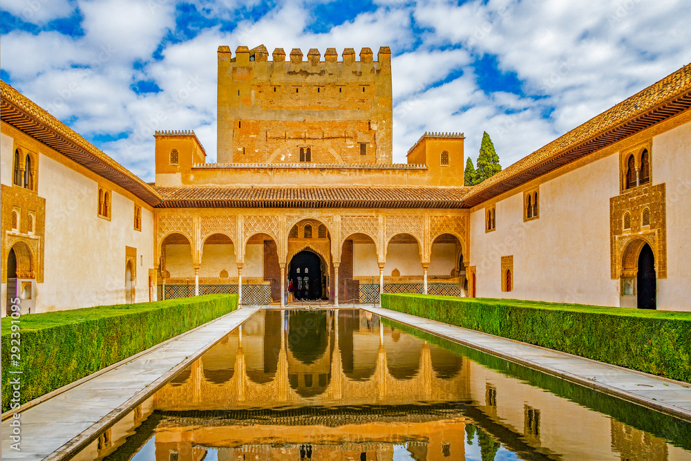 Fototapeta premium Columns and tower of the Alhambra in a sunny day. It´s a Nasrid monument