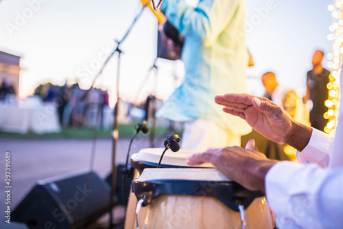 Fototapete Cuban performers playing latino rythms during outdoor party