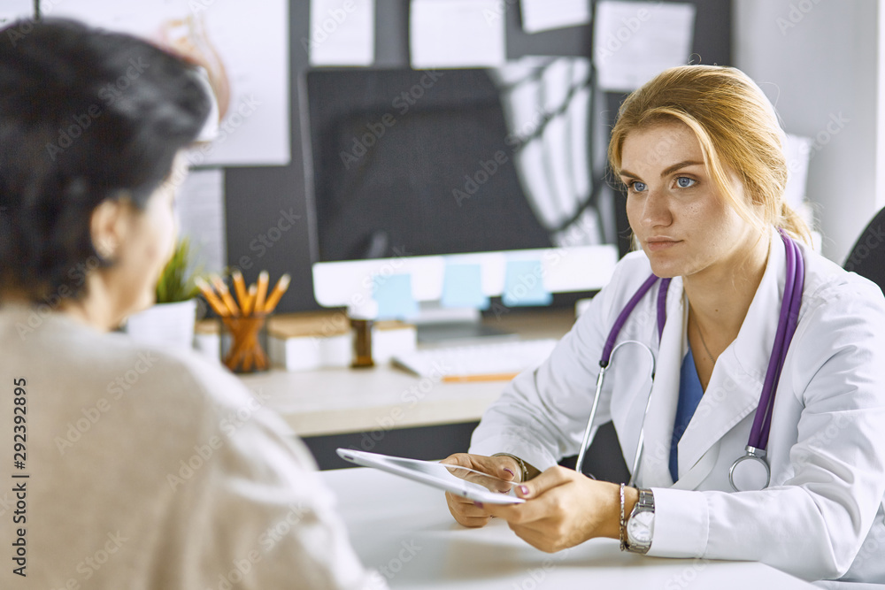 young woman doctor takes patient in office young woman doctor takes patient in office
