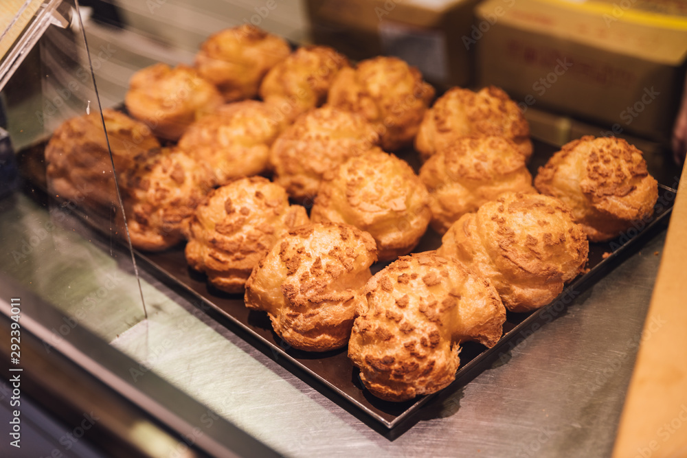 Freshly baked Vanilla Choux Cream Puffs for sell. Fresh Baked Bakery. Freshly baked Vanilla Choux Cream Puffs for sell. Fresh Baked Bakery.