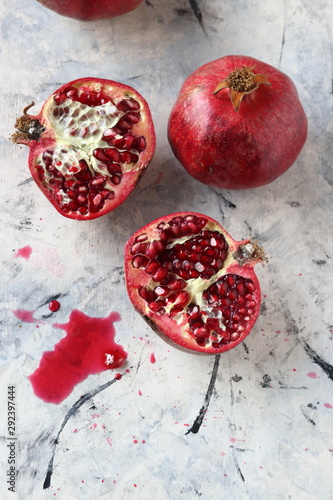 Pomegranate fruits on  a white marble background