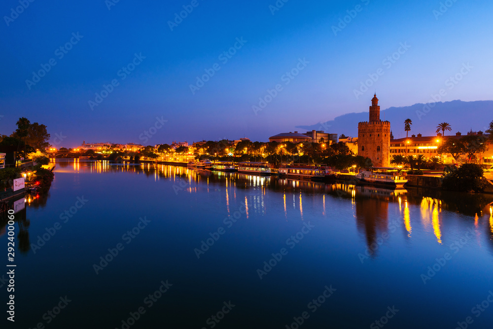 View of La Torre de Oro Tower of Gold in Seville, Spain at night