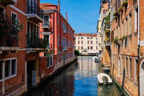 Narrow canal with gondola in Venice, Italy © Dmitry Rukhlenko