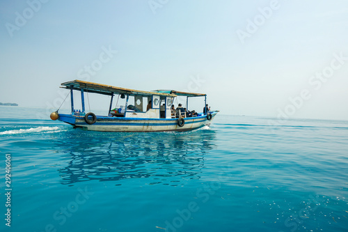 Travel to one of the islands in the Thousand Islands, Jakarta, Indonesia. We use fishing boats to get there. photo