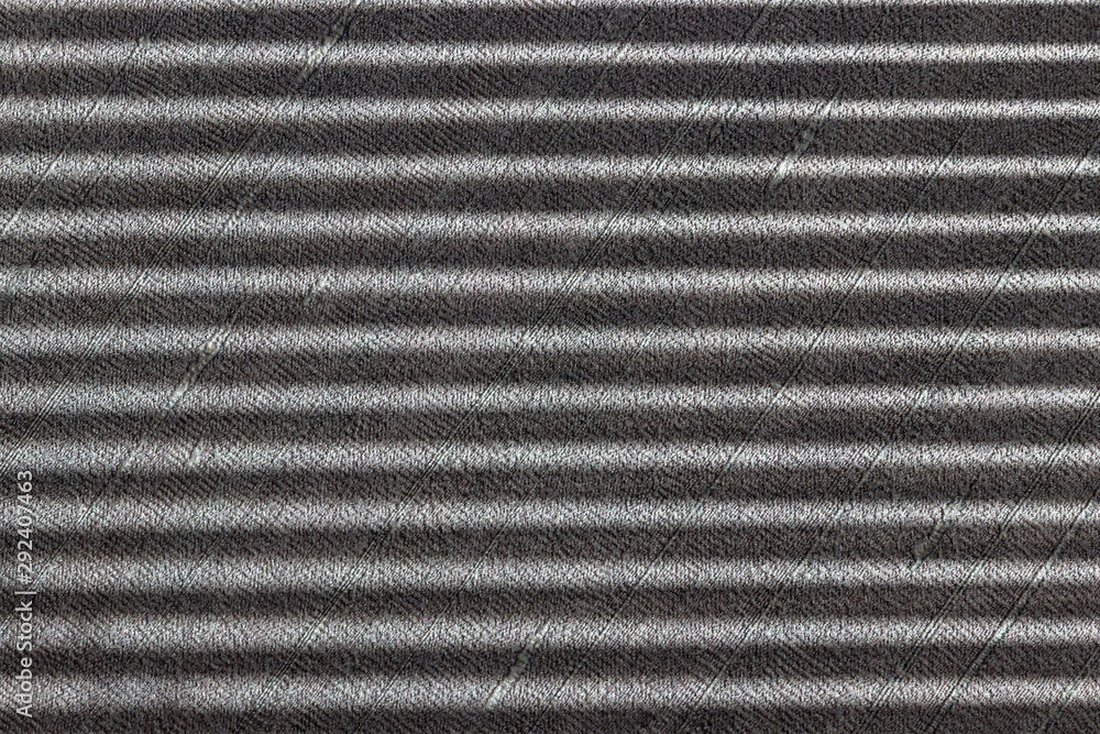 Hard parallel shadows on grey textured wall from a window roller shutter or blinds. Hard parallel shadows on grey textured wall from a window roller shutter or blinds.