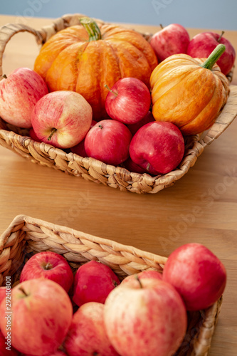Still life with pumpkins and apples in the basket.  Space for text. Happy Thanksgiving background.