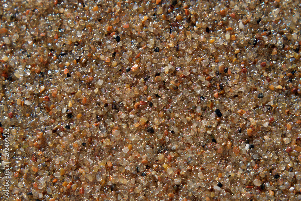 Wet sand grains texture background. Closeup. Top view Wet sand grains texture background. Closeup. Top view