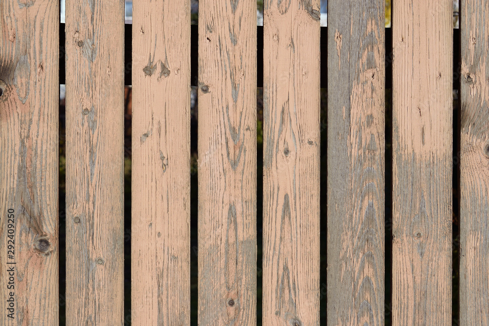 Old wood fence with cracked and peeling off paint Old wood fence with cracked and peeling off paint
