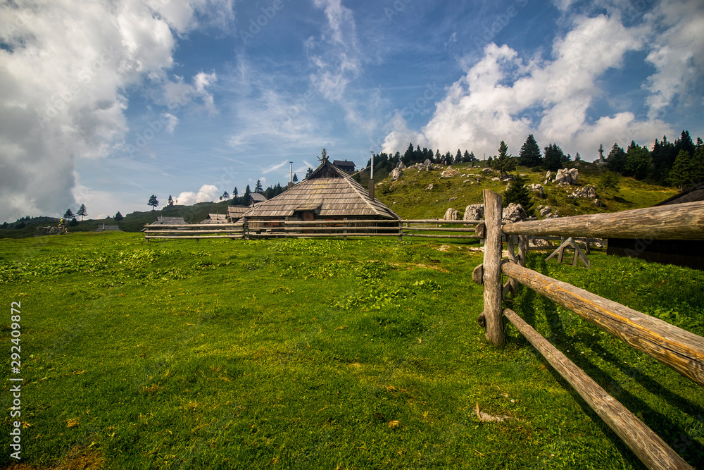 High plateau of Velika Planina, land of pastures and alpine huts high in the mountains, Slovenian Alps