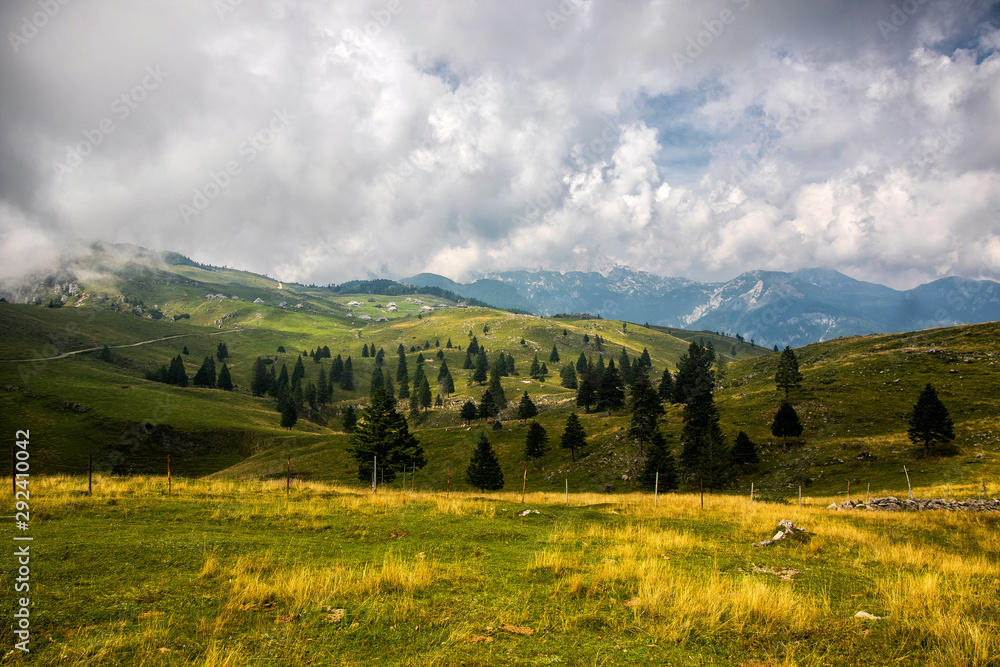 High plateau of Velika Planina, land of pastures and alpine huts high in the mountains, Slovenian Alps