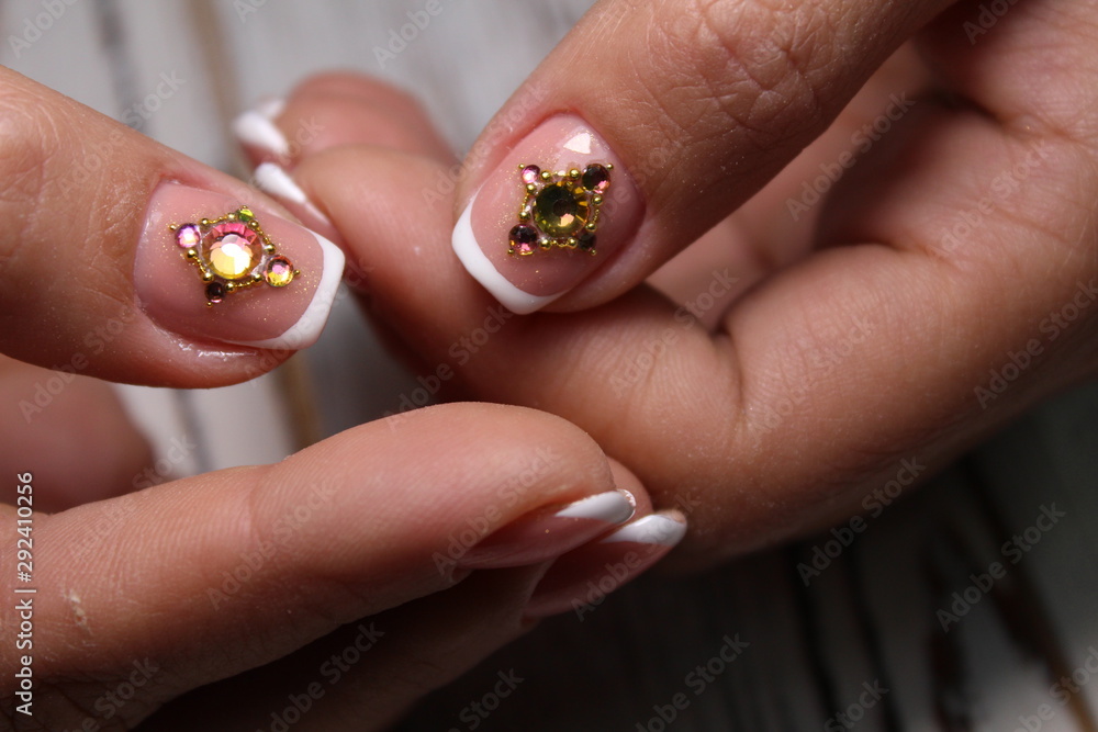 Closeup photo of a beautiful female hands with elegant manicure Closeup photo of a beautiful female hands with elegant manicure