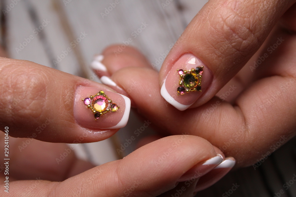 Trendy manicure design on a beautiful background. Trendy manicure design on a beautiful background.