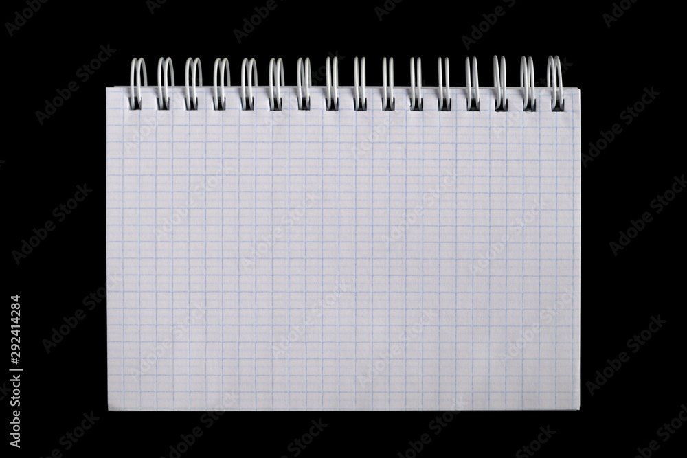 Grid sheet open notebook isolated on black. Top view Grid sheet open notebook isolated on black. Top view