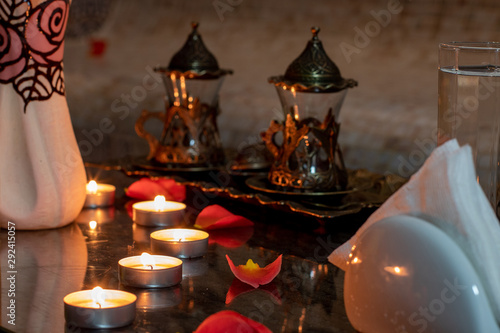 romantic spa table with candles and rose petals