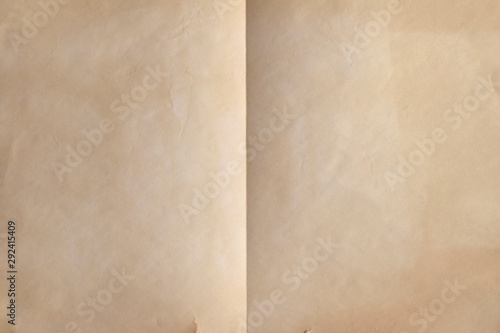 Old weathered sheet of paper folded in half