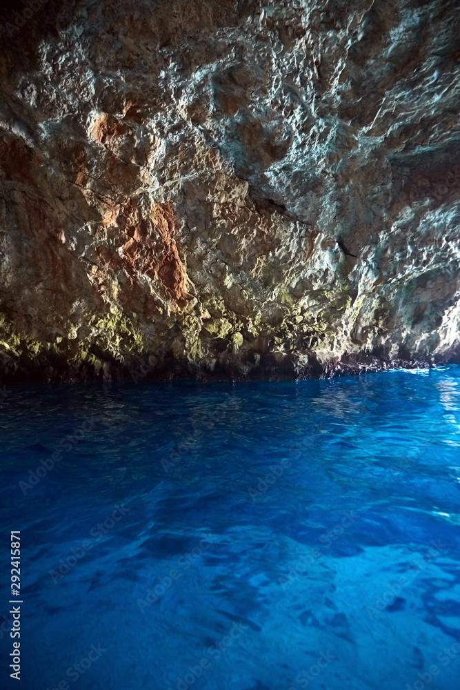 Blue Cave, Montenegro. Sea grotto with water look blue. Stone cave arch