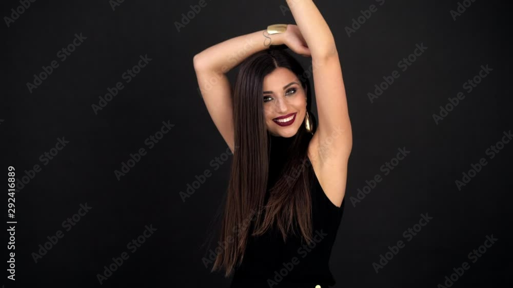 girl with bright makeup throws up a confetti on a black background girl with bright makeup throws up a confetti on a black background