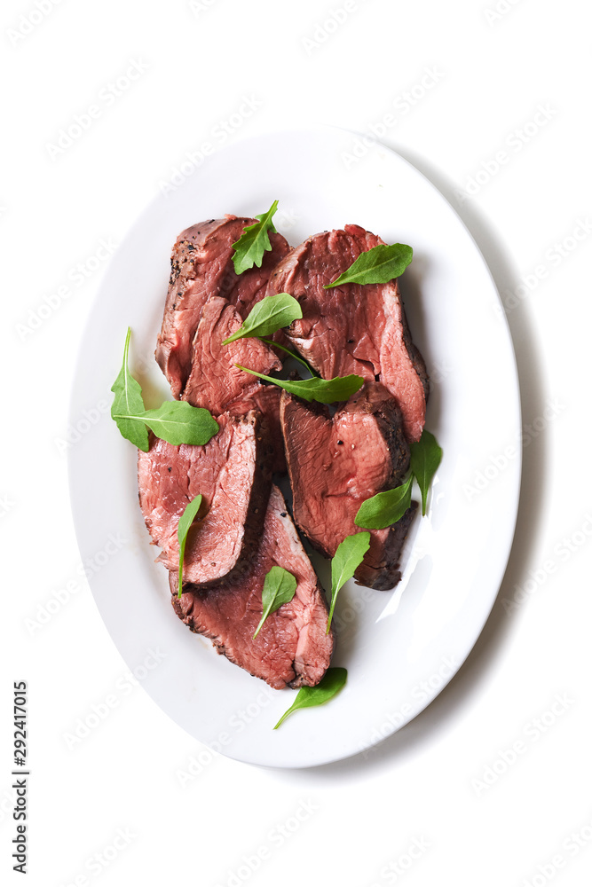 plate with sliced medium rare roast beef plate with sliced medium rare roast beef
